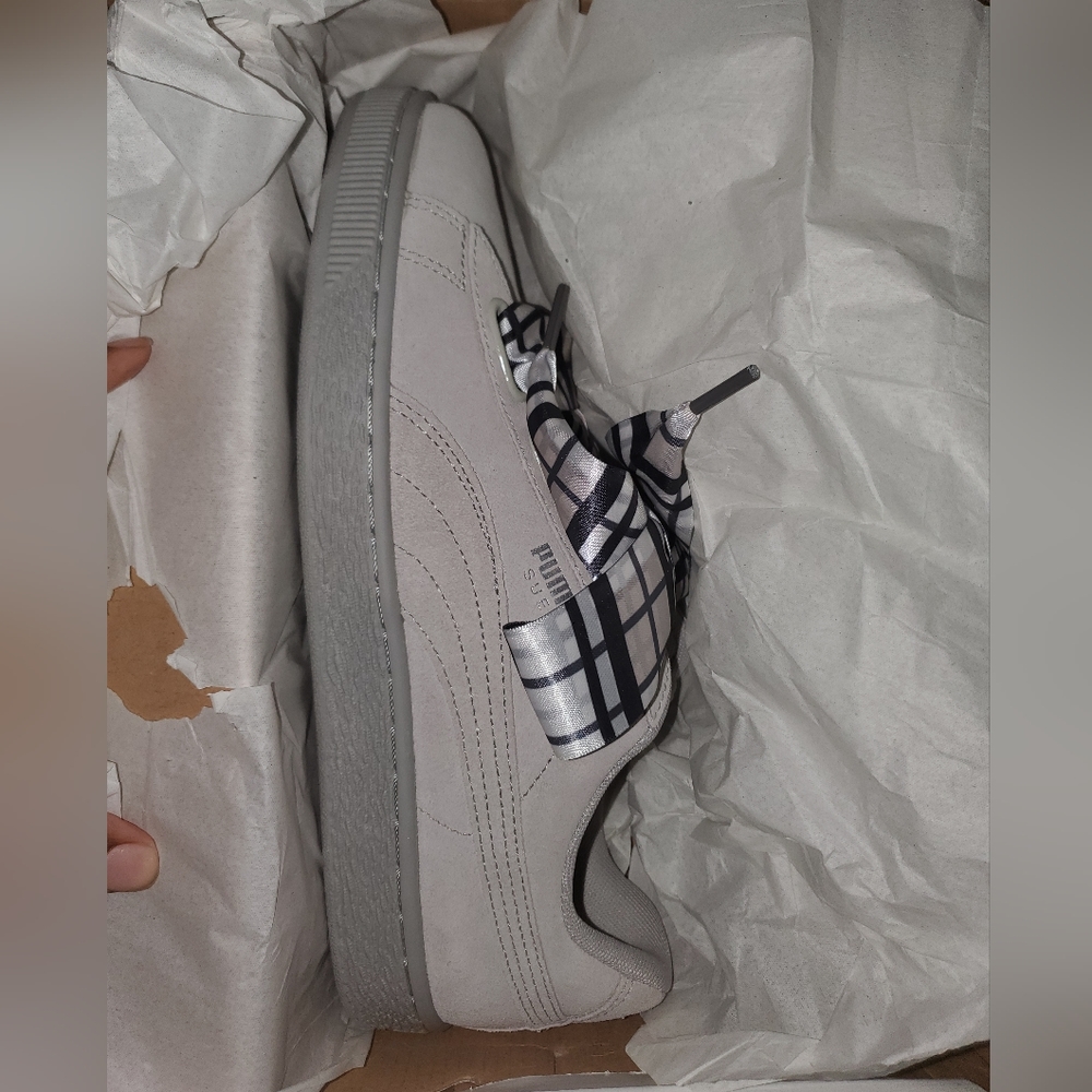 Puma Women's Suede Heart Plaid. Shoe string are plain sneakers are grey.